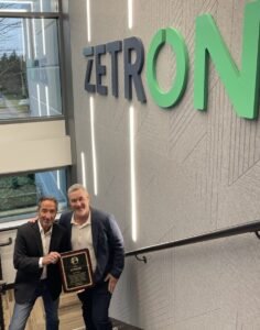 Crime Stoppers Global Solutions Vice-Chairman Jim Fuda presents an Appreciation Plaque to Zetron's CEO Scott French for his continued support.